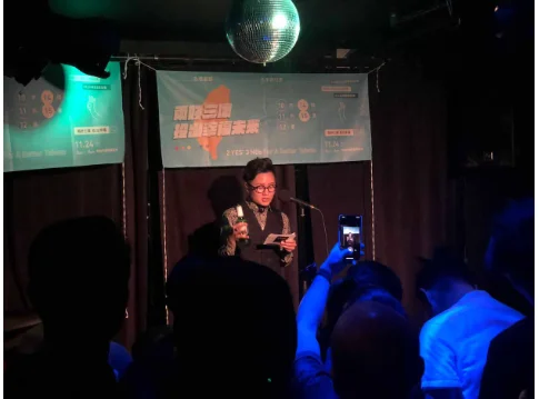 Wen Liu speaking to the crowd